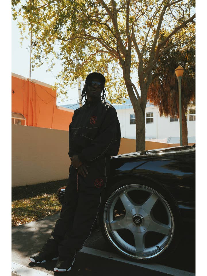 Black Red MOTION Nylon Pants (BRED) for wholesale on Faire12