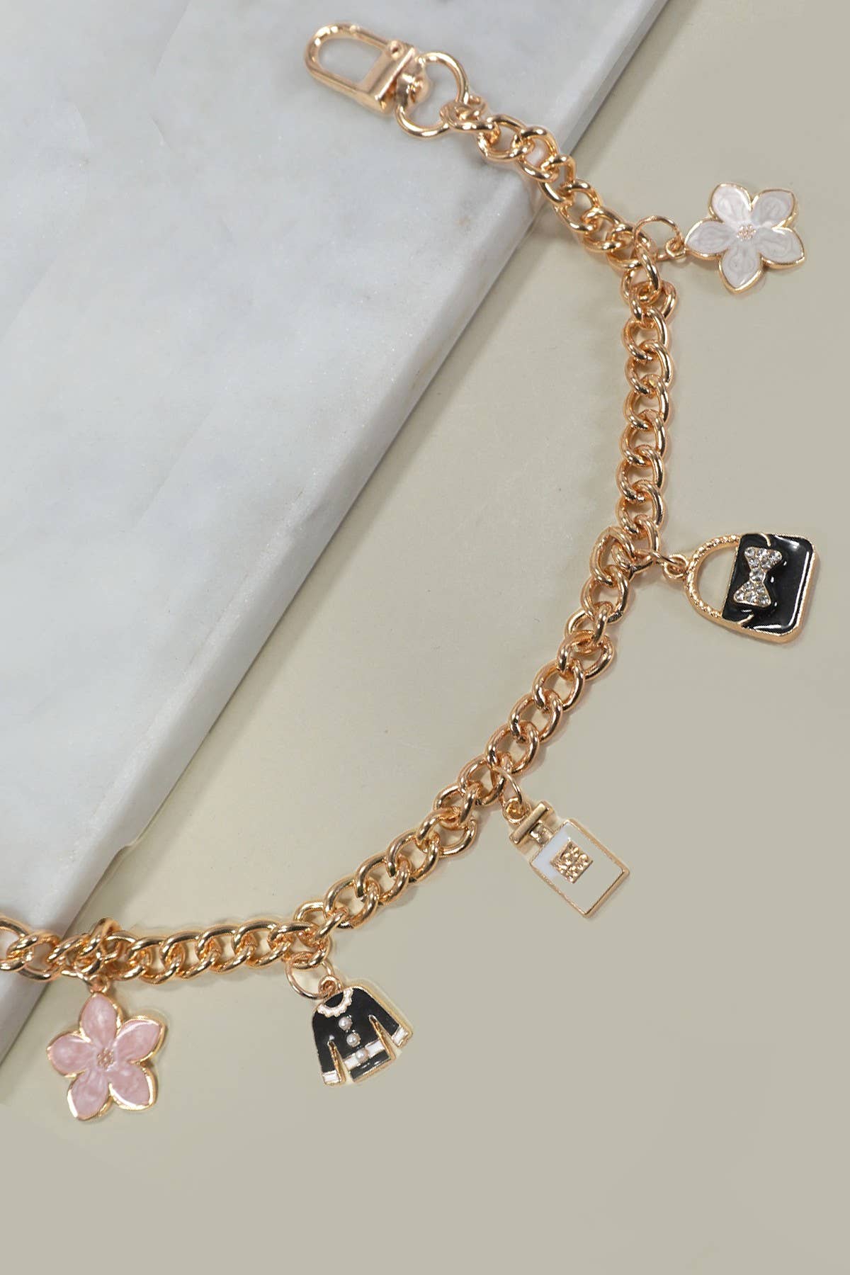 Gold BAG CHARM-CHAIN TOP BAG FLOWER PERFUME | 40KC120 for wholesale on Faire1