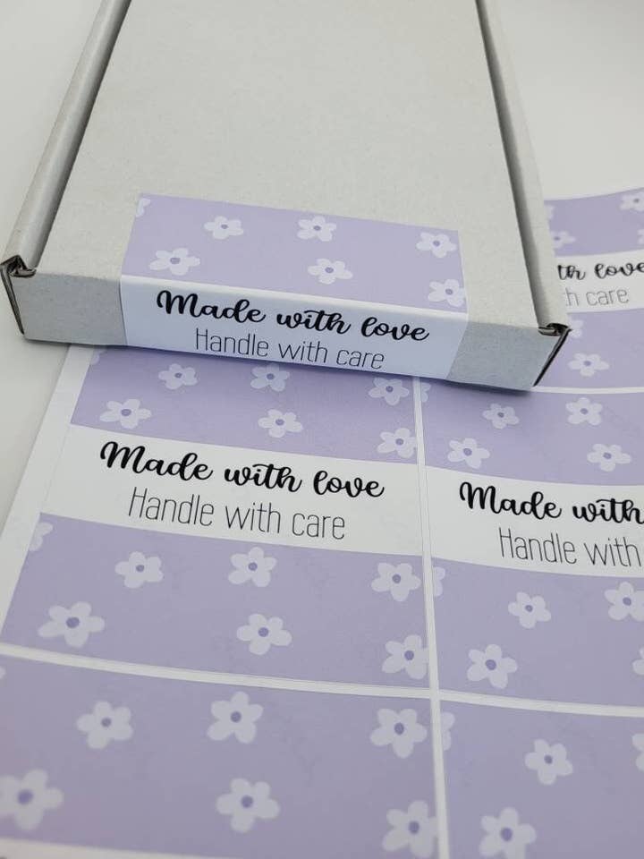 X6 Purple Flower Box Seal Labels, Matching Sticker Packaging for wholesale by The Sticker Scene