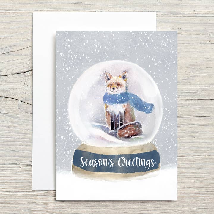 Carte de vœux aquarelle de renard fantaisiste et boule à neige pour la vente par Christy Obalek Illustration