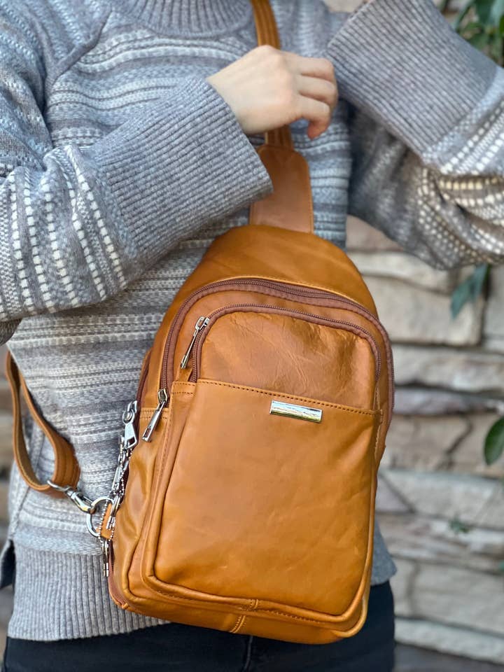 Wax oil cowhide leather sling/crossbody bag for wholesale by Roma Leathers, Inc.