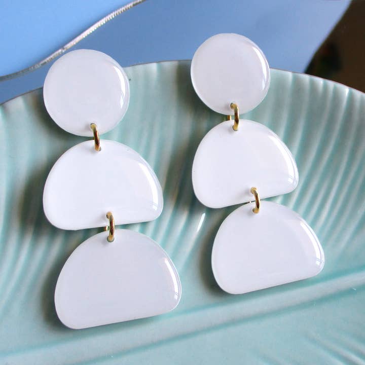 White Half Moon Earrings - Crescent Moon Tier Studs for wholesale by Wuve