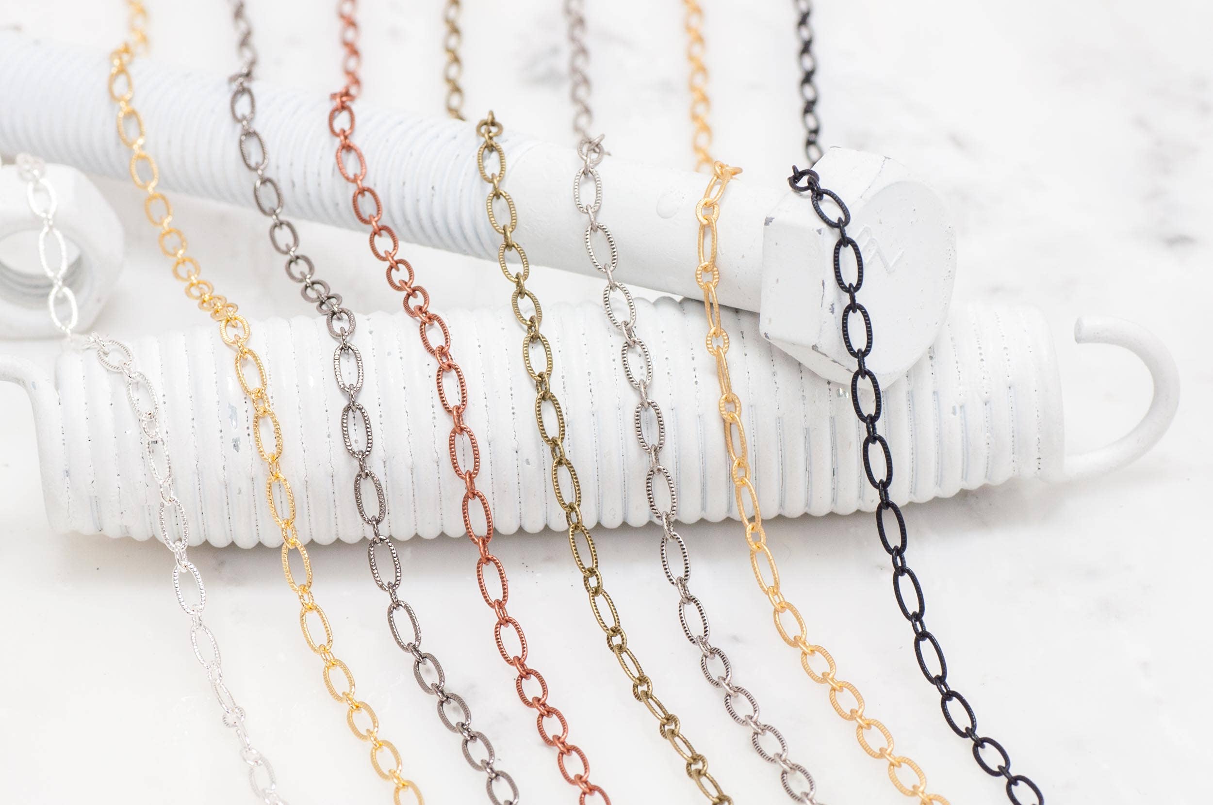 Continental Beads - Wholesale Craft Supplies - 6.4mm x 3mm Textured Oval Cable Chain Sold by The Foot - CH 8208