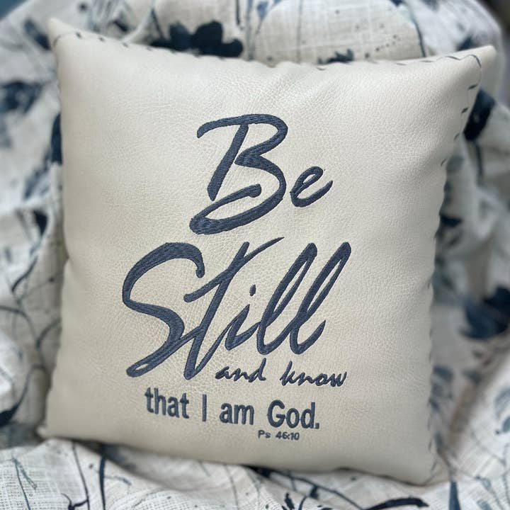 Vegan Leather Scripture Pillow – “Be Still & Know” Accent for wholesale by The Home and Hearth Market