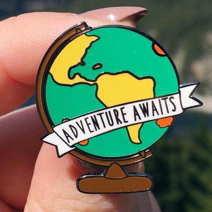 Adventure Awaits Globe Enamel Pin for wholesale by Sleepy Mountain