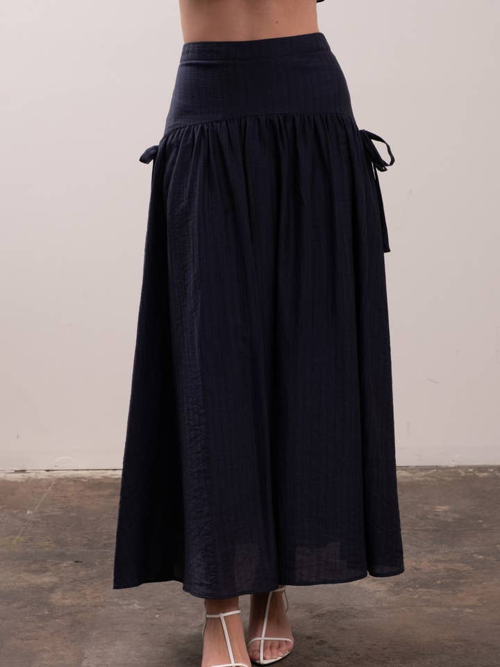 NAVY RIBBON SIDE DETAIL A-LINE MIDI SKIRT for wholesale on Faire