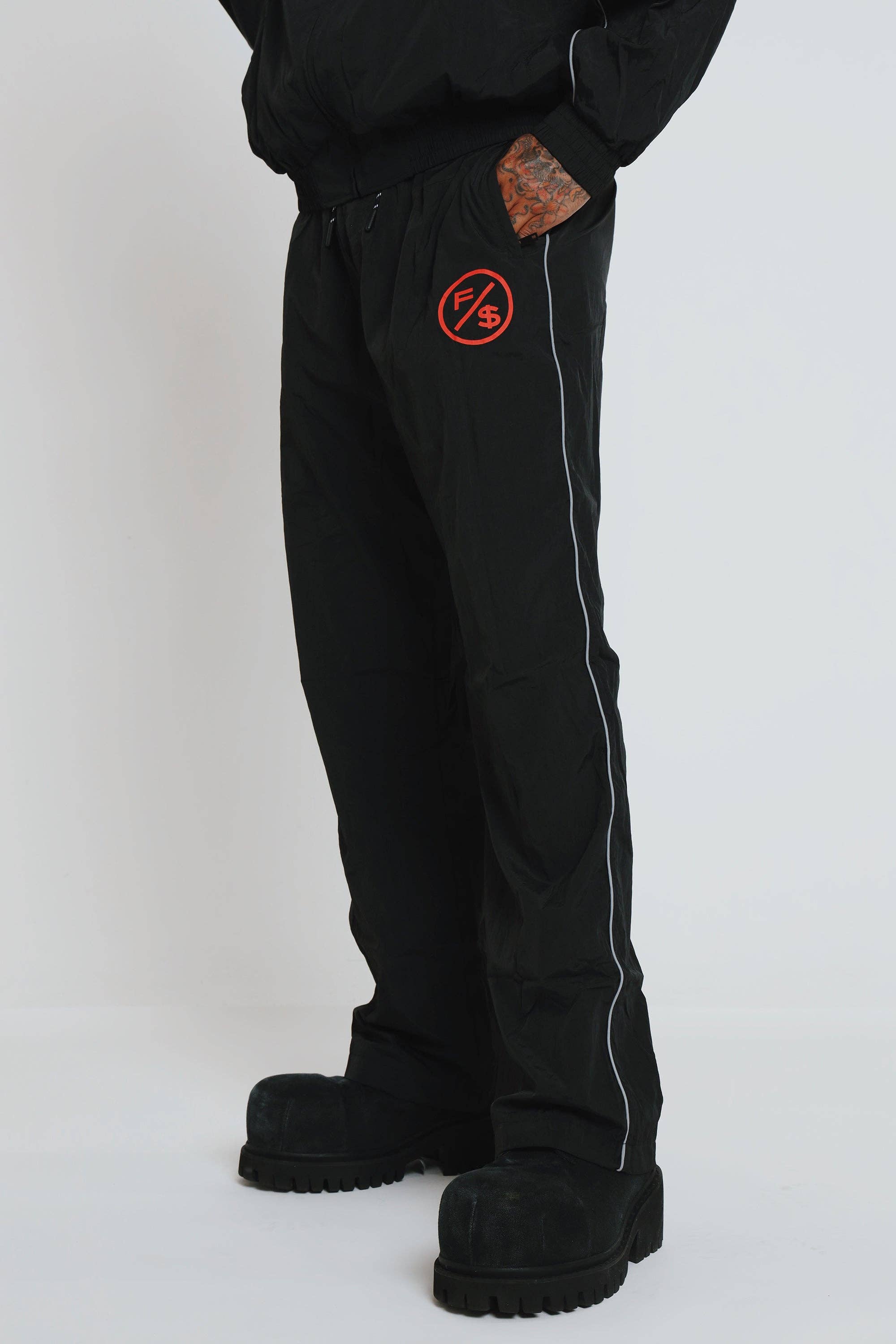 Black Red MOTION Nylon Pants (BRED) for wholesale on Faire11