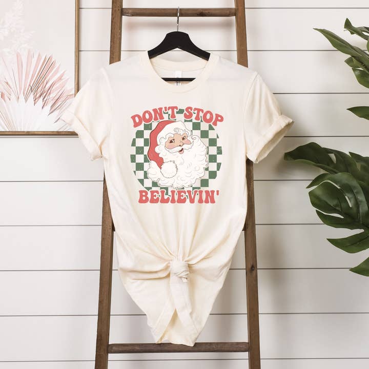 Don't Stop Believin' Santa Natural Tee for wholesale by Simply Tees