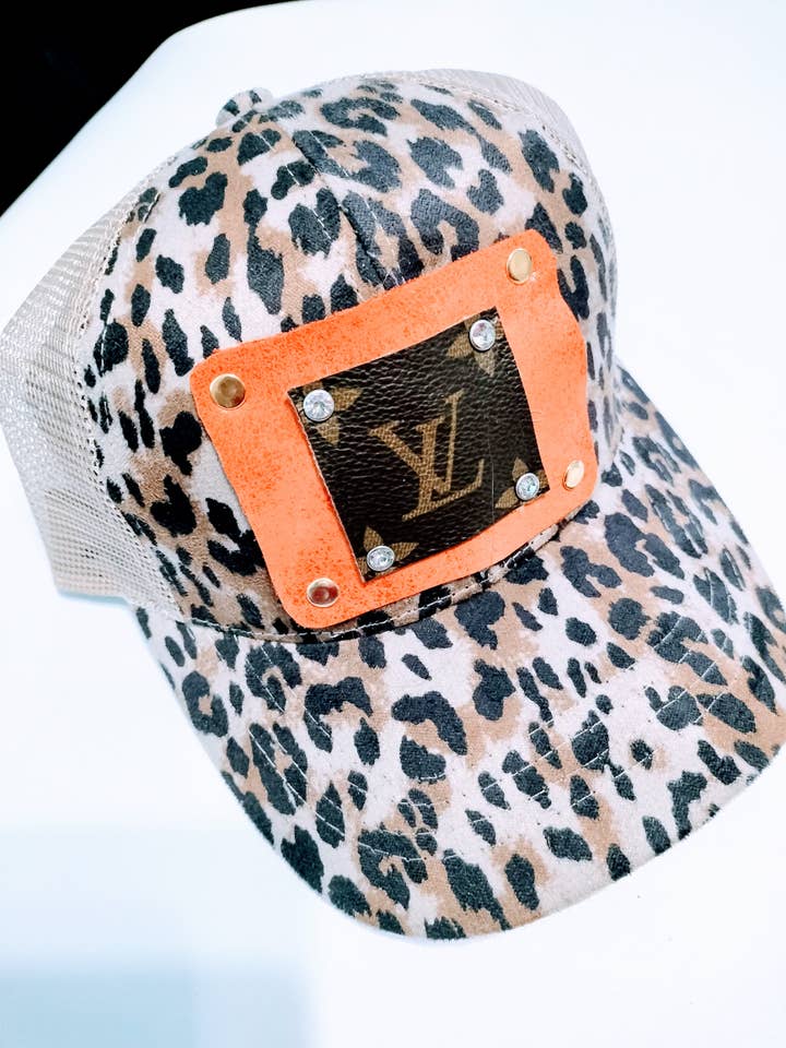 Leopard and orange upcycled hat for wholesale by Contagious Couture