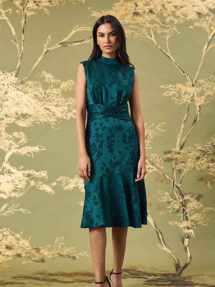 HIGH NECK MIDI DRESS W/ ASYMMETRICAL FLARED HEM for wholesale by Maggy London Group