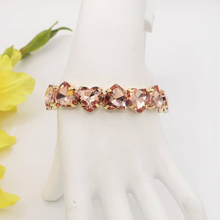 SALMON LUCE HEARTS Roséguld SET - Halsband, örhängen och armband med fasetterade stenar för wholesale på Faire