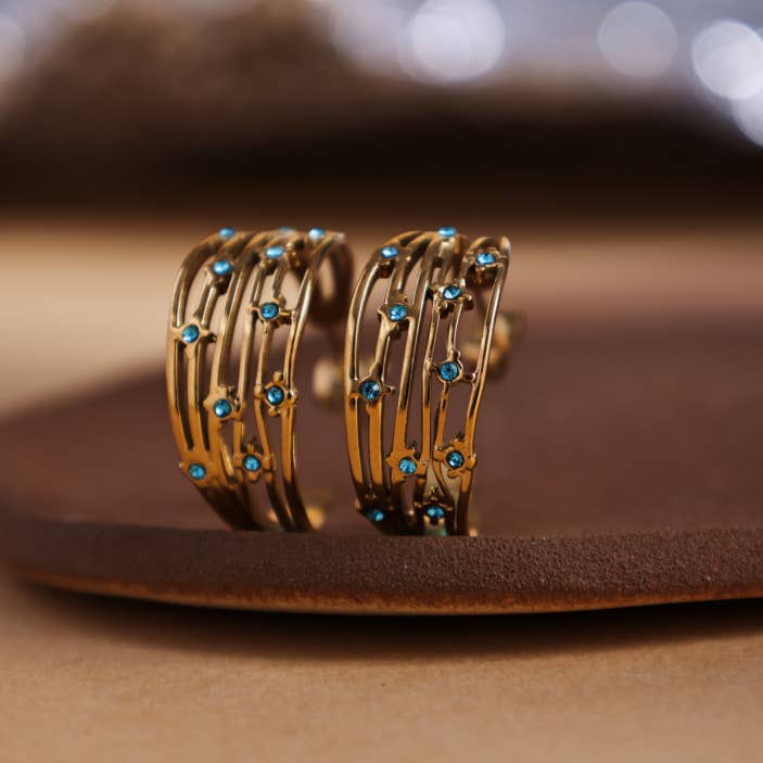 Revelari – wholesale Hoop earrings – Gold Hoop Earrings with Blue Crystal Accents2
