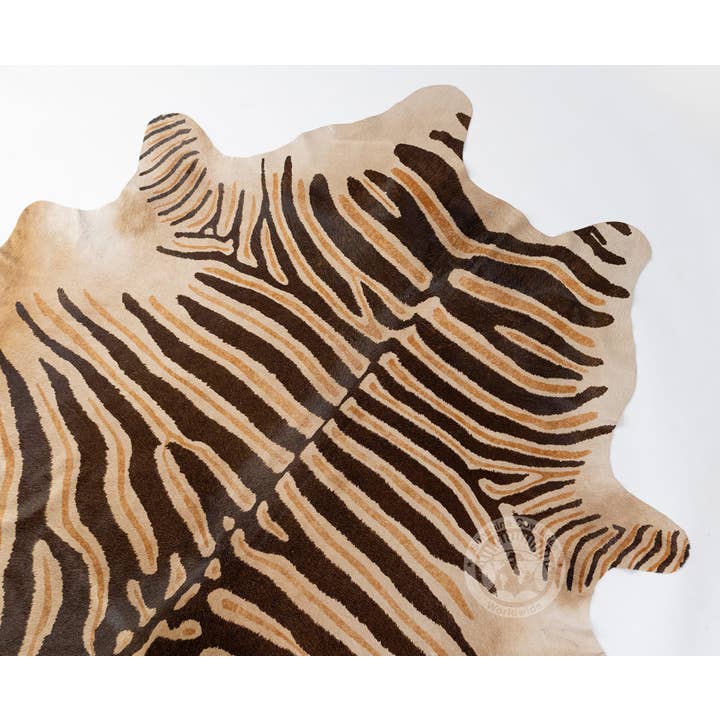 Brown Wild Zebra Stripes on Beige Cowhide Rug for wholesale on Faire2