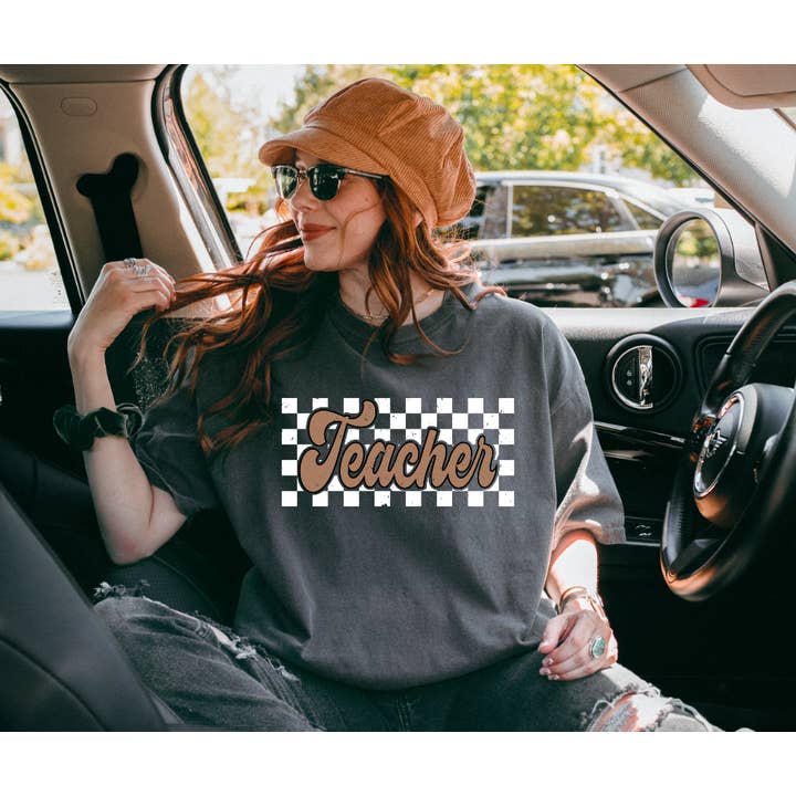 Teacher Checkered Print on Pepper Tee for wholesale by The Red Rival Wholesale