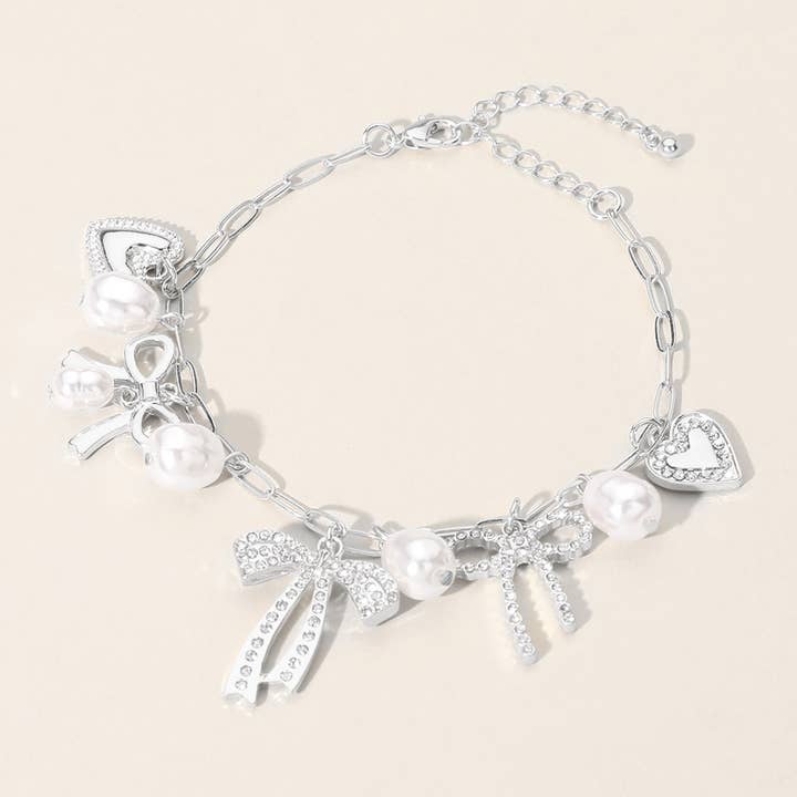 Sensibling Corp. - Wholesale Charm/Dangle Bracelet - Stone Paved Bow Heart Pearl Charm Station Chain Bracelet