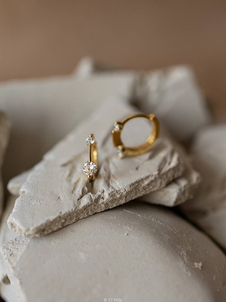 Twin Crystal Huggies. Evi for wholesale by O'Milo