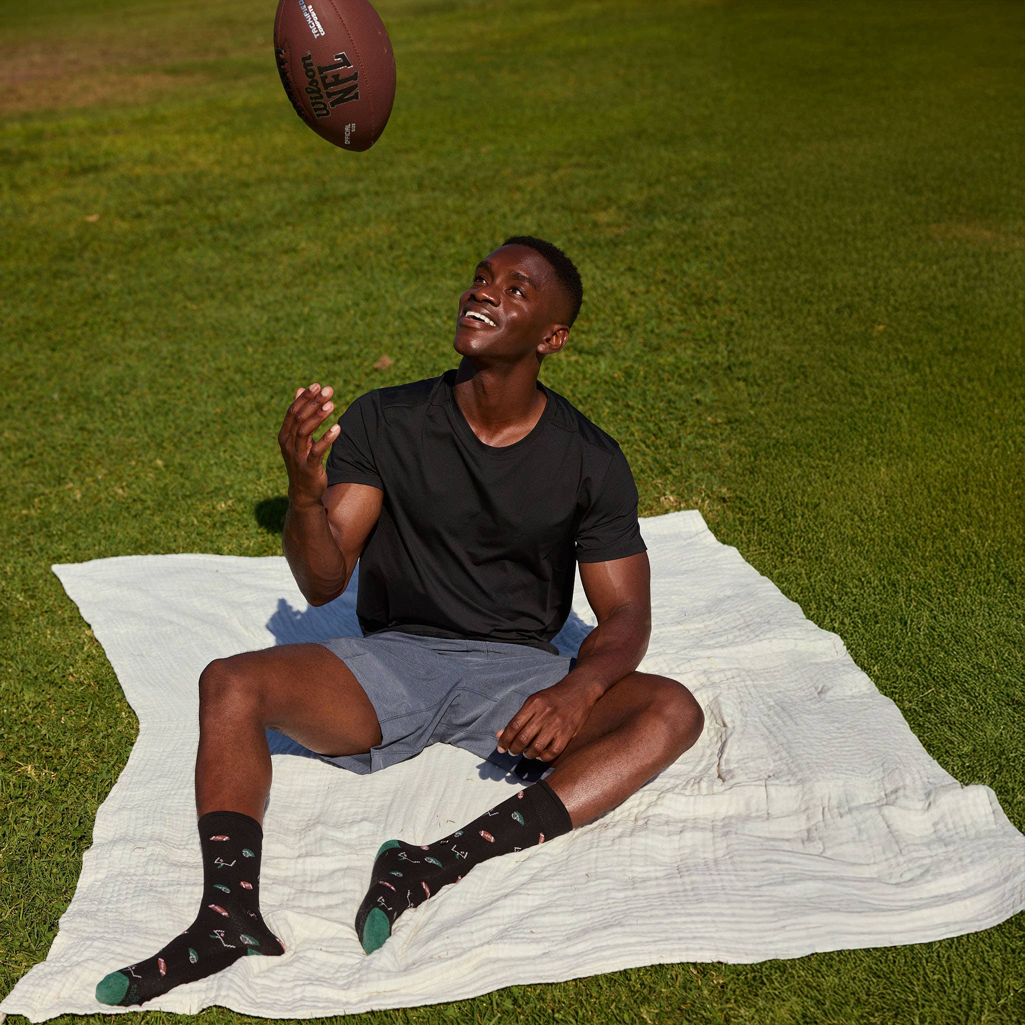 Conscious Step - Wholesale Socks - Unisex - Socks that Support Youth Sports (Black Footballs)4