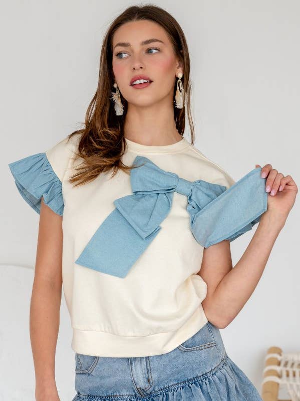 TR2049-01_DENIM MIX AND MATCH BOW SHORT FLUTTER SLEEVE TOP for wholesale by TRENDILITY
