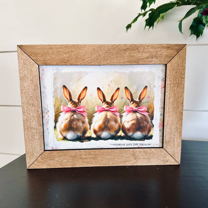 8.5x6.5” Framed Trio of Bunnies with Pink Bows for wholesale by Farmhouse Decor & Co.