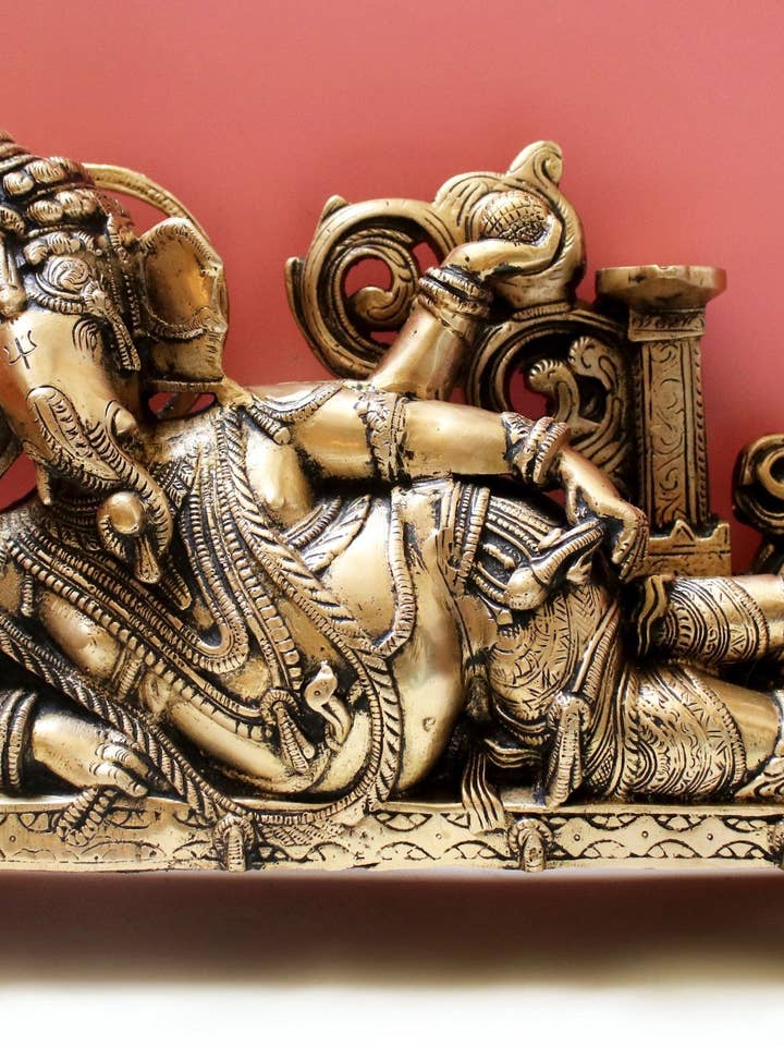 14" Reclining Ganesha with Lamp (Diya) In Brass | Handmade for wholesale by Exotic India Art