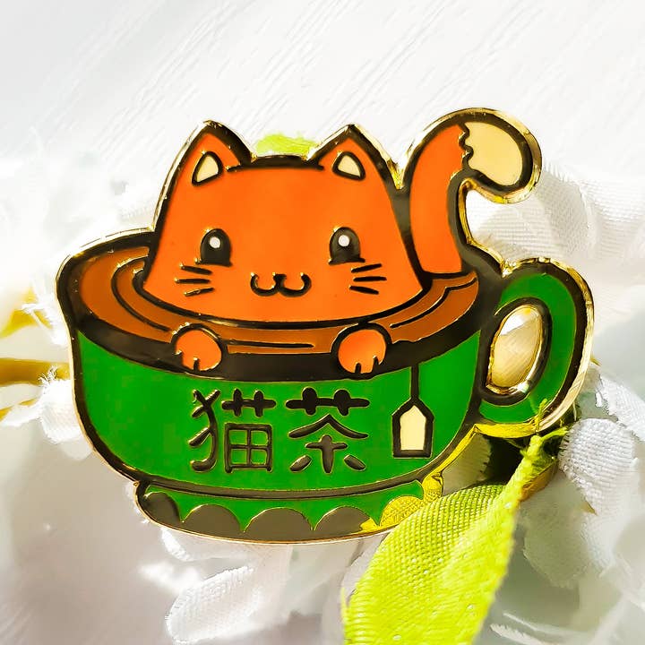 Kittea Ceremony Chai (Orange) Tea Kitty Enamel Pin for wholesale by Atomik Cupcake Designs