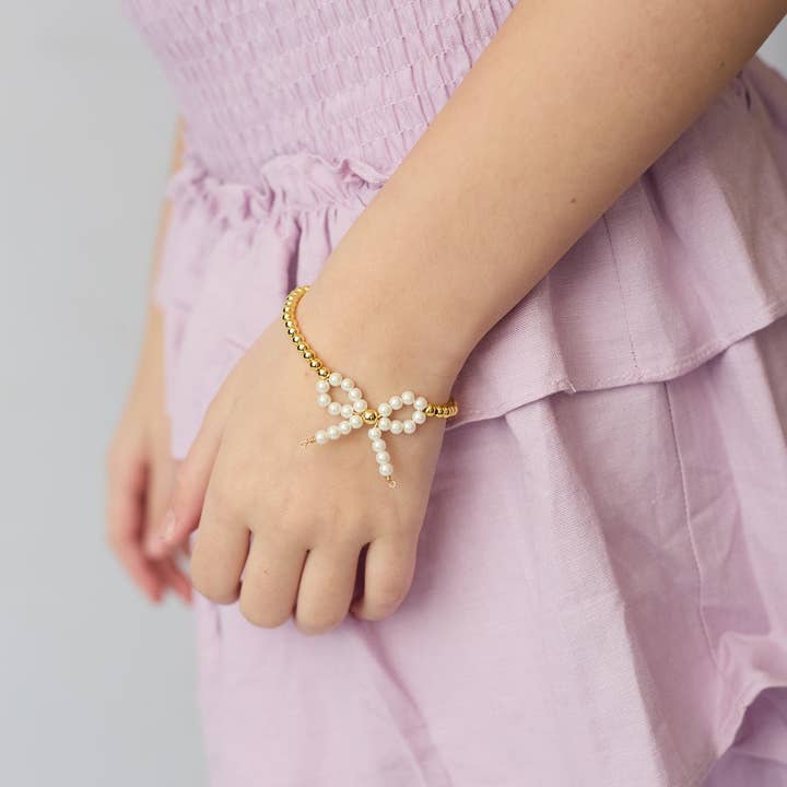 Pearl Bow & Gold Beaded Bracelet for wholesale by Over the Moon Gift