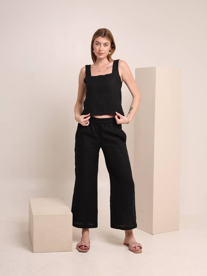 Linneset i solid svart färg för kvinnor - ärmlös topp för wholesale av Fabthread