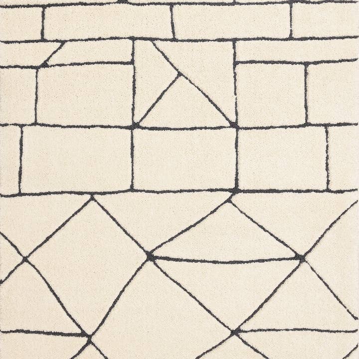 Tapis de zone géométrique crème et noir 5' x 8' pour la vente par HomeRoots