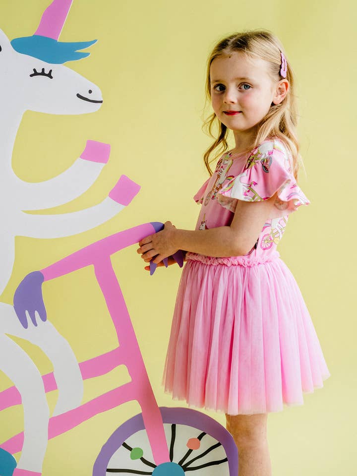 Pink UNICORN BIKE CHERIE TULLE DRESS for wholesale on Faire1