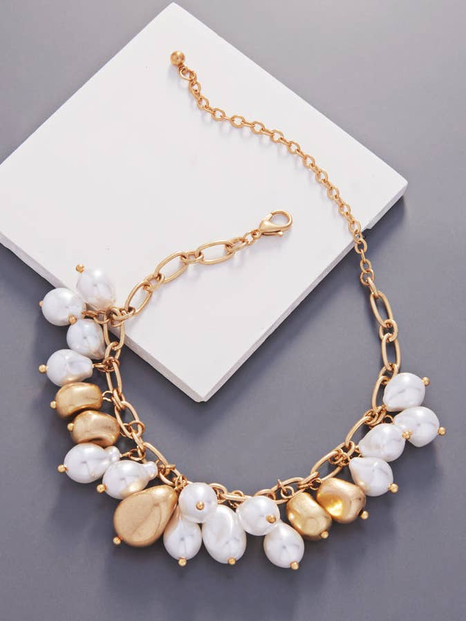 Mixed Charm Shaped Vintage Pearl Clasp Bracelet for wholesale by Designature New York