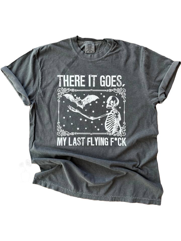 There It Goes, My Last Flying F*ck – Skeleton + Bat Tee for wholesale by Pick Your Poison Tees LLC (Formerly Wandering Owl Designs)