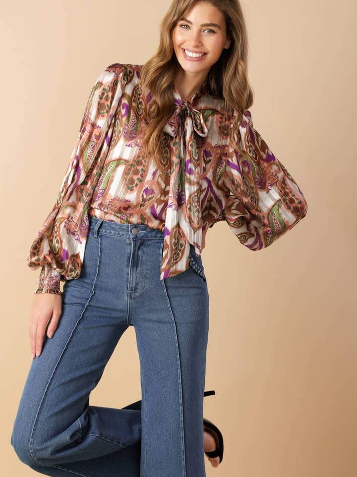 A printed woven top - IT13432 and other Purchase Wholesale strut and bolt. Free Returns & Net 60 Terms on Faire trending on Faire.