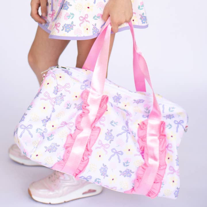 Ruffle Duffle in Blooms + Bows for wholesale by Poppyland