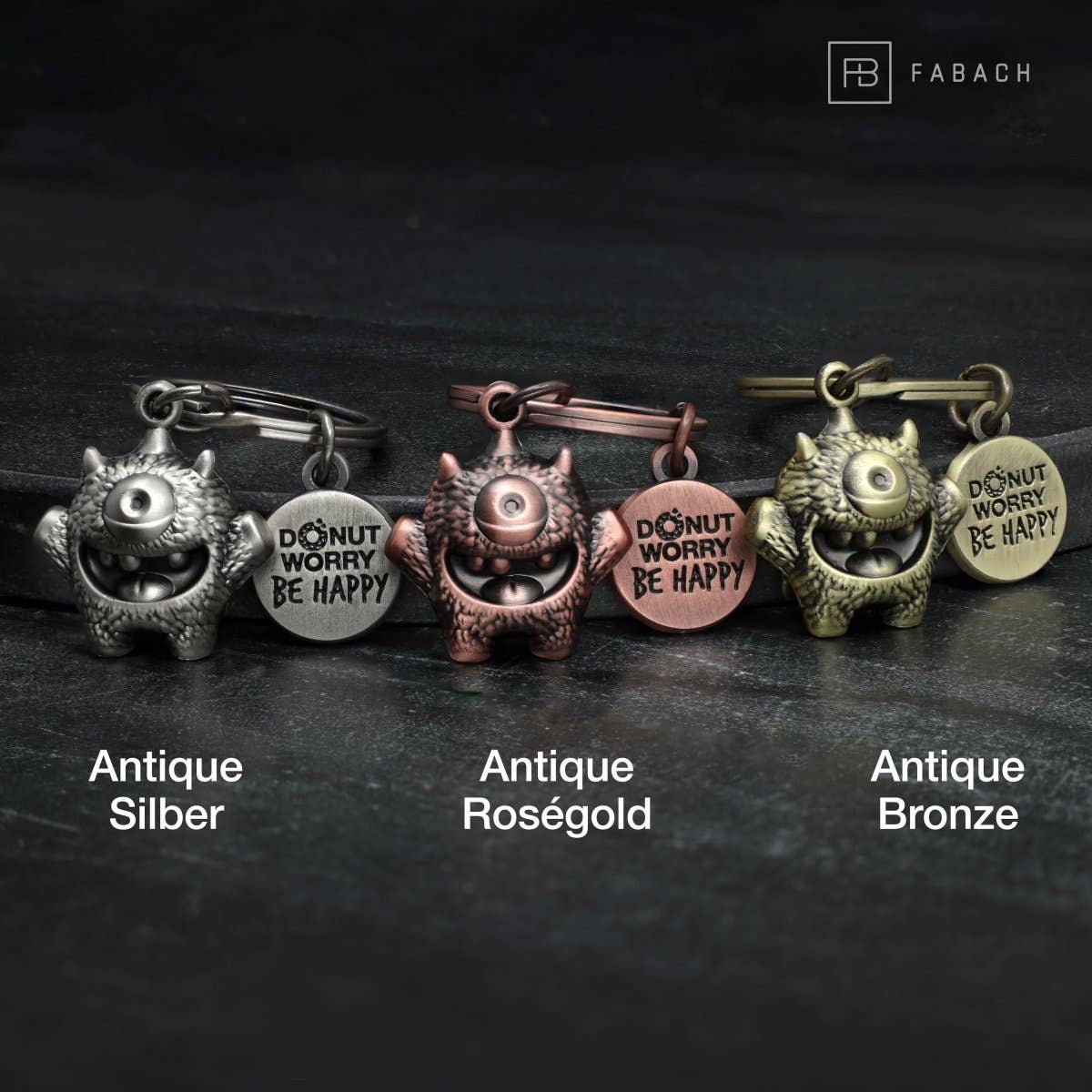 FABACH – Die Schlüsselanhänger-Schmiede – Porta-chaves - Unissexo por atacado – Chaveiro 'Cyklops' de incentivo – monstrinho sorteado com gravação 'Donut worry, be happy!' – amuleto da sorte Kummermampfer5