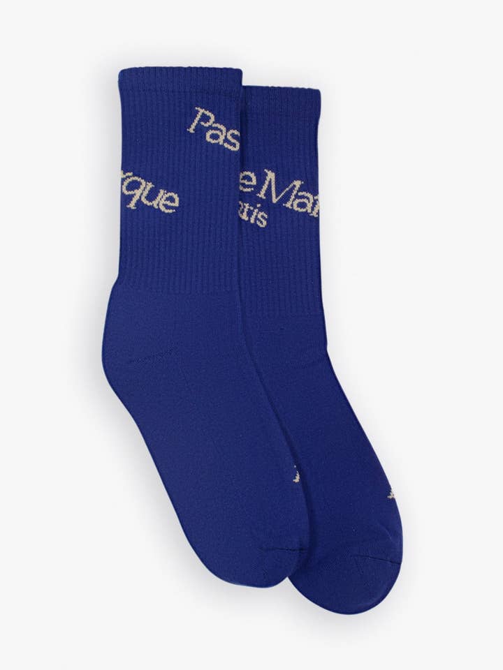 Calzini asimmetrici (viola/beige) per la vendita all'ingrosso da parte di Pas Une Marque