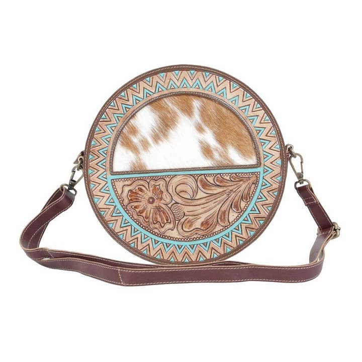 Cowhide hand tooled leather round crossbody shoulder bag for wholesale by The Sterling Gypsy