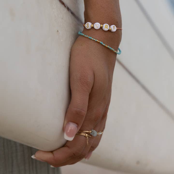 Wear Your Heart Word Bracelets in Gold for wholesale by Nica Life