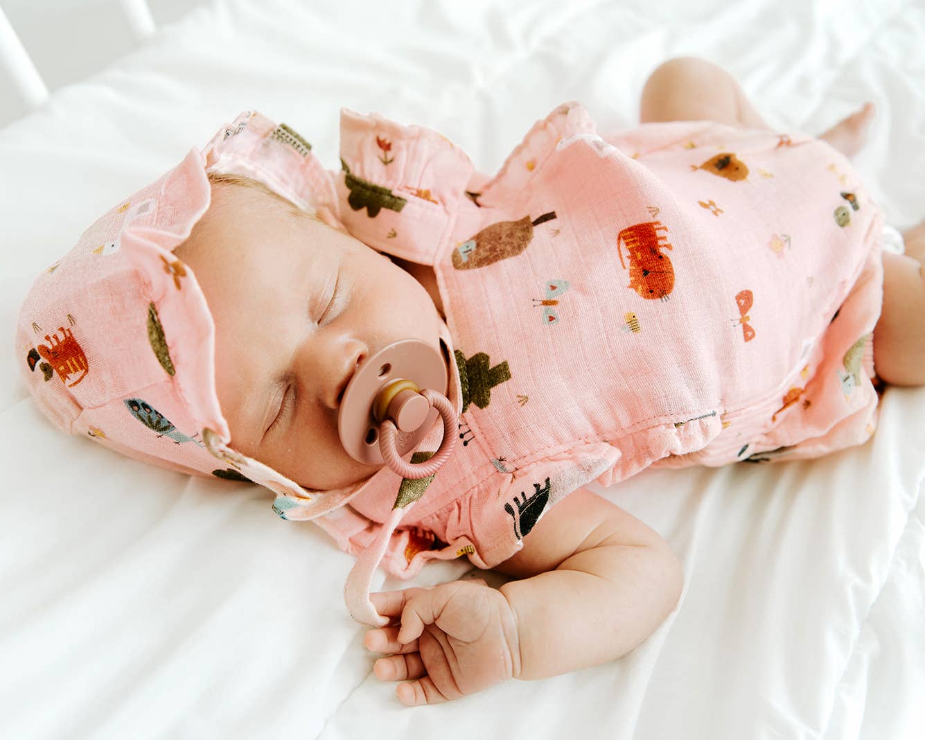 Blush Farm Ruffle Criss Cross Short Baby Romper (Organic Muslin) for wholesale on Faire4