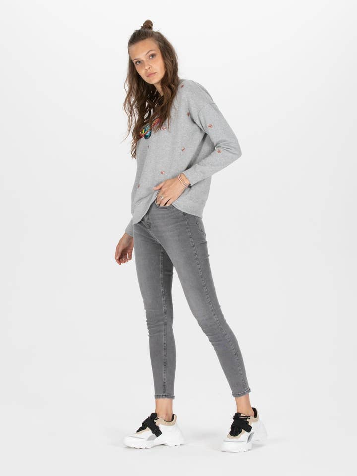 Maglione a tema galassia con motivo pianeti in paillettes per la vendita all'ingrosso da parte di Shiva Diva