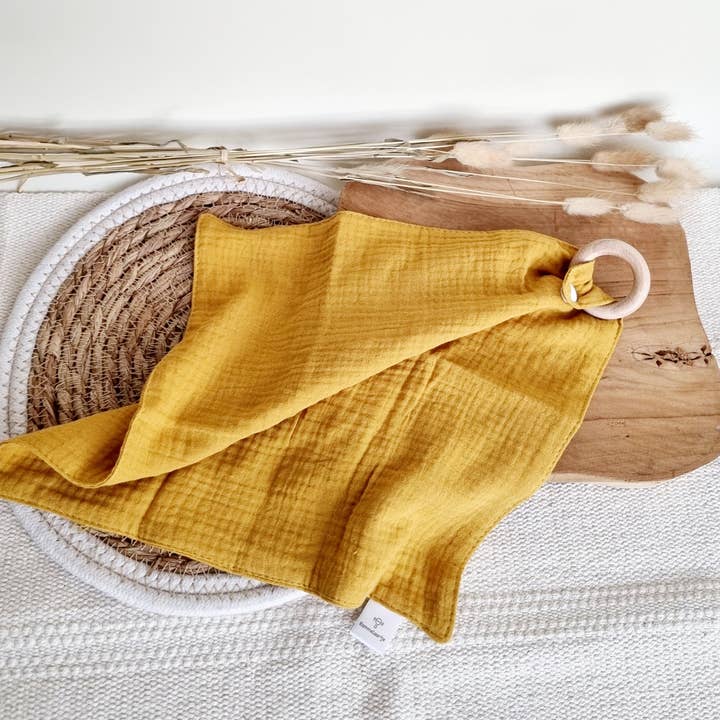 Cuddle cloth with beech teether - Ochre yellow for wholesale by Rammelaartje
