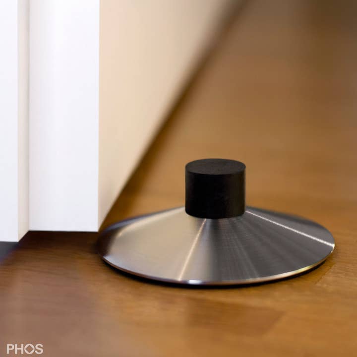 stainless steel door stopper/Volcanino door wedge Ø80 mm, height 28 mm for wholesale by PHOS Design GmbH