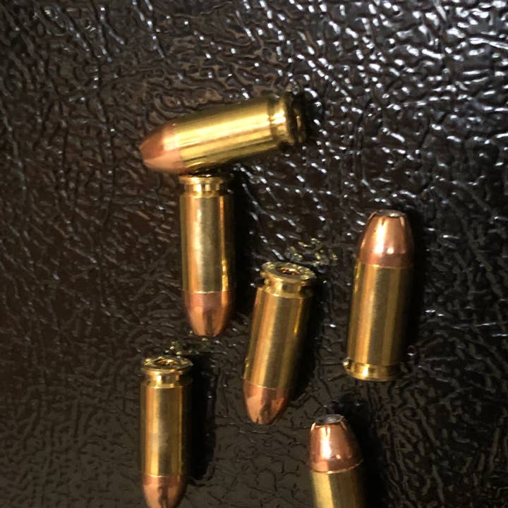 6 Pack of Real 9MM Hollow Point Bullet Fridge Magnets for wholesale by MB Designs
