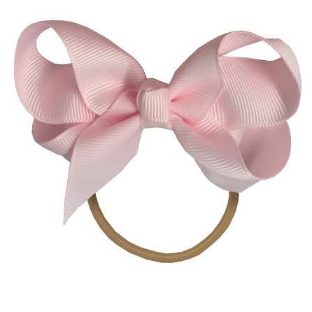 Maxima hair bow with elastic band in powder pink for wholesale by La Fillette Accessories