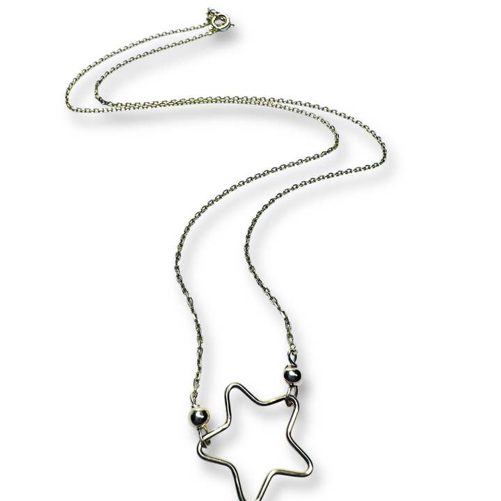 Collier étoile dorée pour la vente par Janine’s Jewelry Design