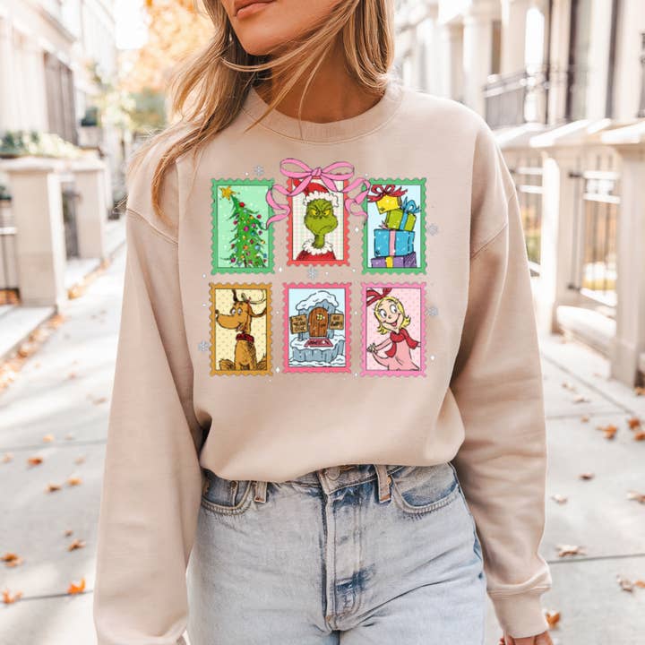 Pull ou T-shirt graphique avec motif Grinch pour la vente par Sam & Seb Co.