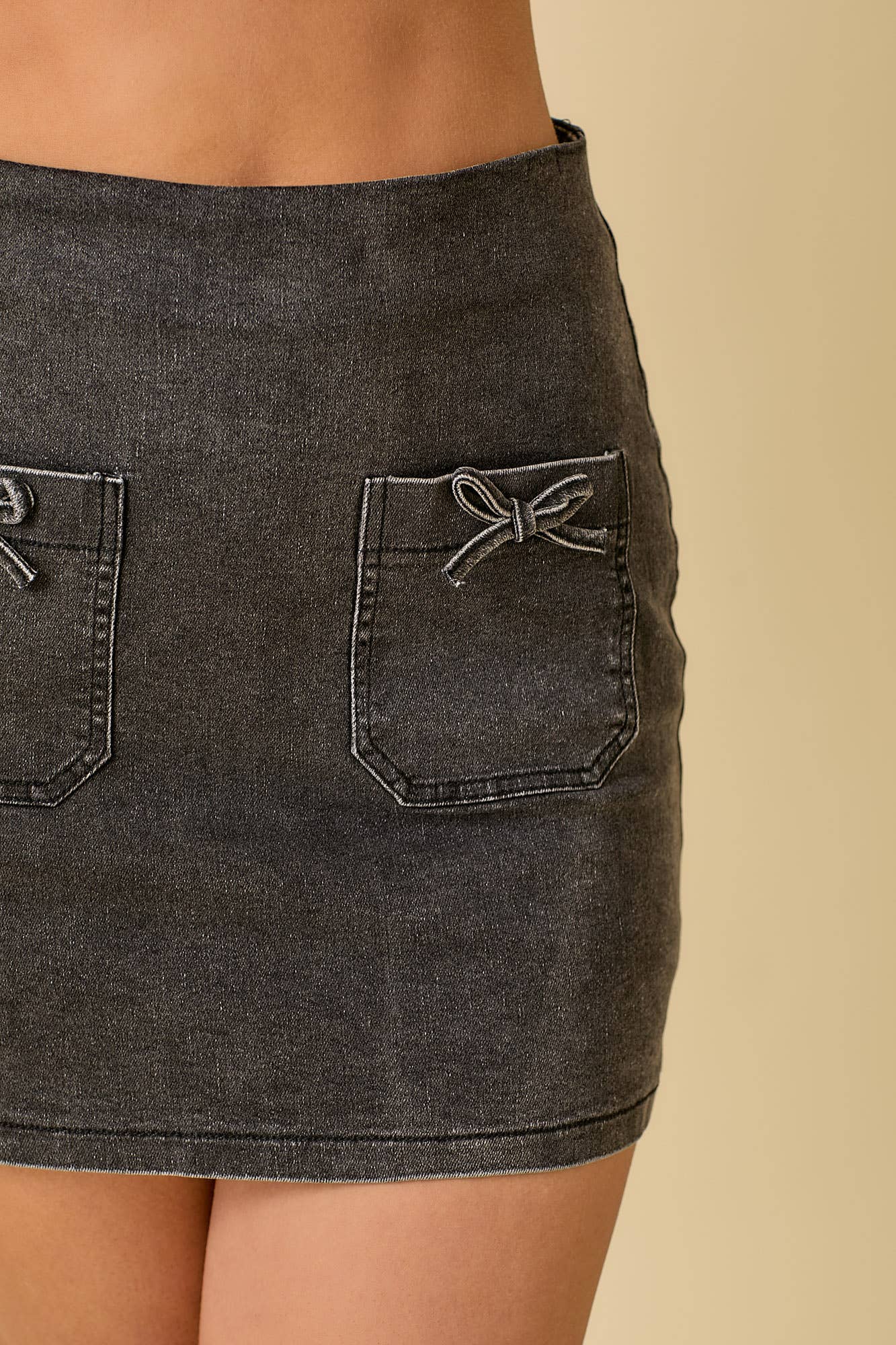 Black Mini Denim Skort With Front Pocket And Ribbon Bow for wholesale on Faire3