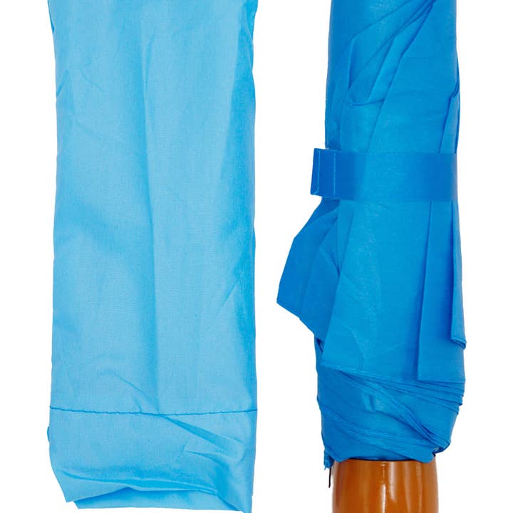 SURTIDO Paraguas compacto manual sólido de 8 paneles y 3 pliegues de venta al por mayor en Faire3