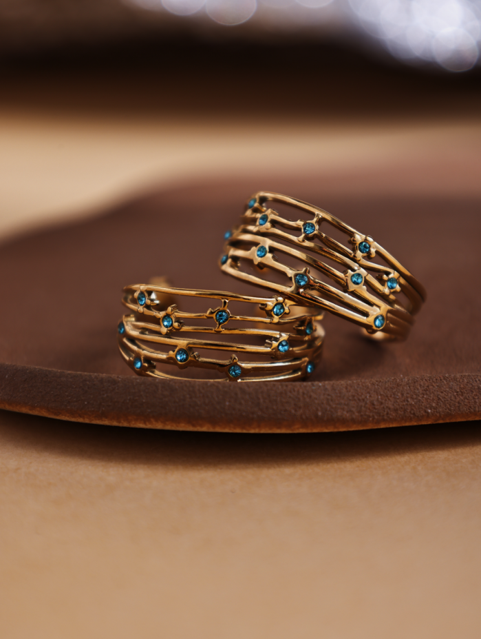 Revelari – wholesale Hoop earrings – Gold Hoop Earrings with Blue Crystal Accents0