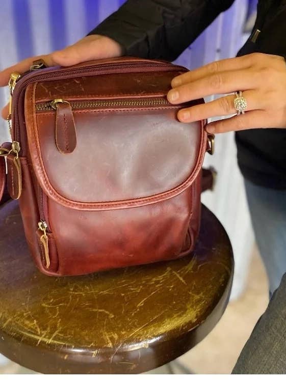 Vintage cowhide crossbody with wire shoulder strap for wholesale by Roma Leathers, Inc.