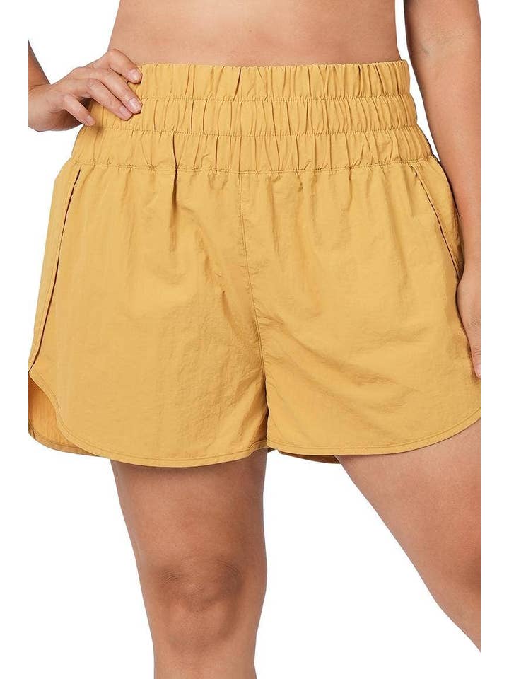LT MUSTARD Plus Windbreaker Smocked Waistband Running Shorts for wholesale on Faire